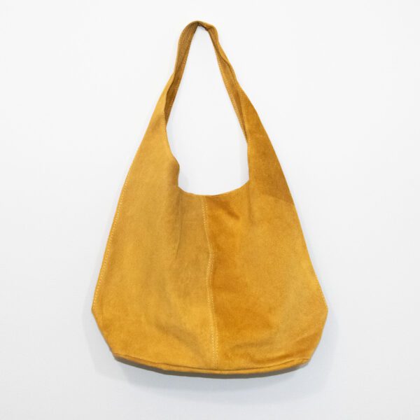 Mustard colored suede leather hobo bag on white background